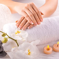 French manicure with spa towel and candles