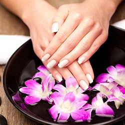 Manicure over an orchid soak bowl