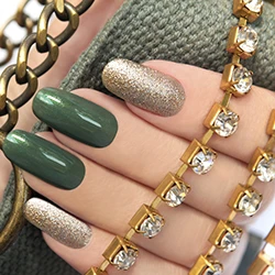 Olive and glitter manicure with jewelry